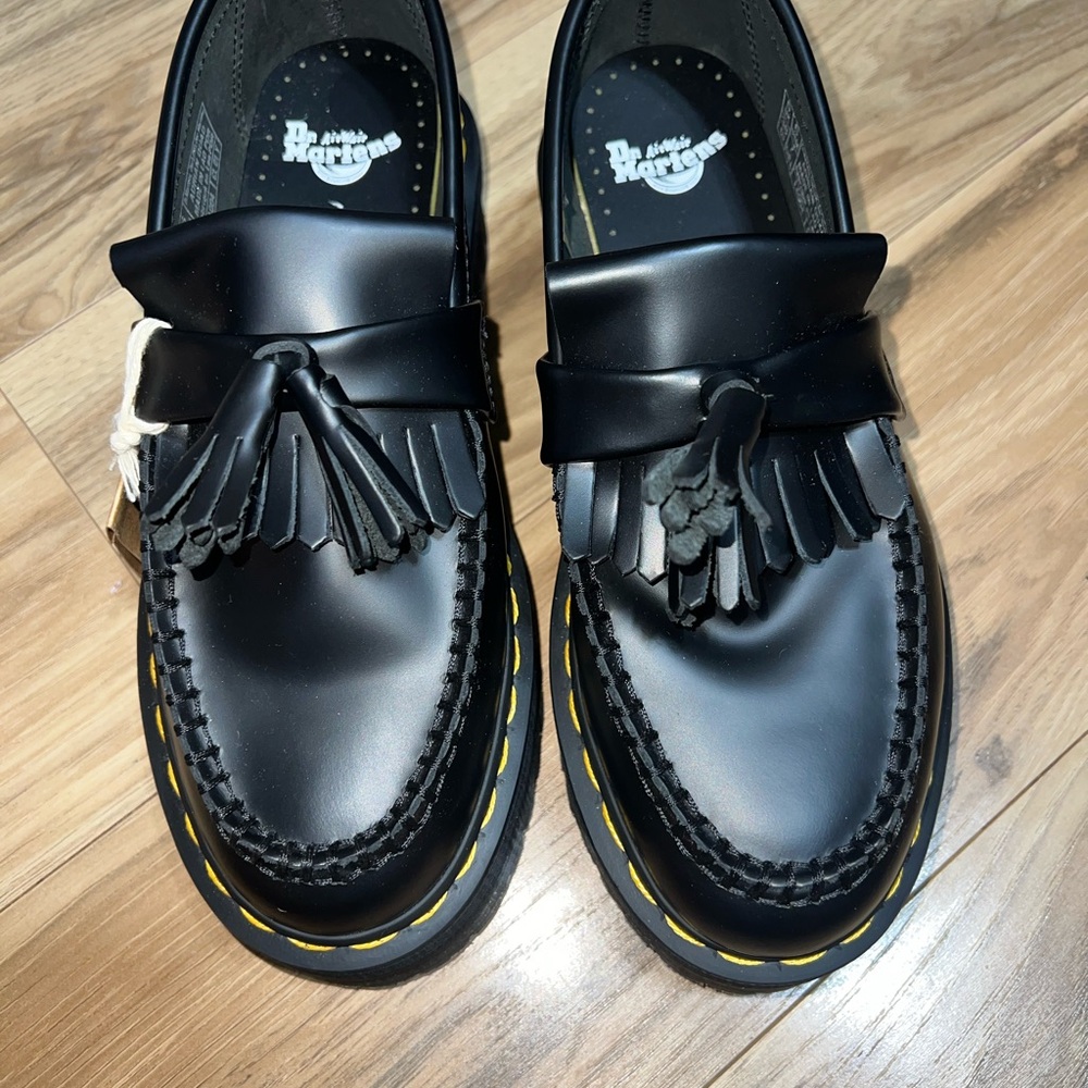 Dr. Martens Black Tassel Kiltie Loafers with Yellow Welt Stitching